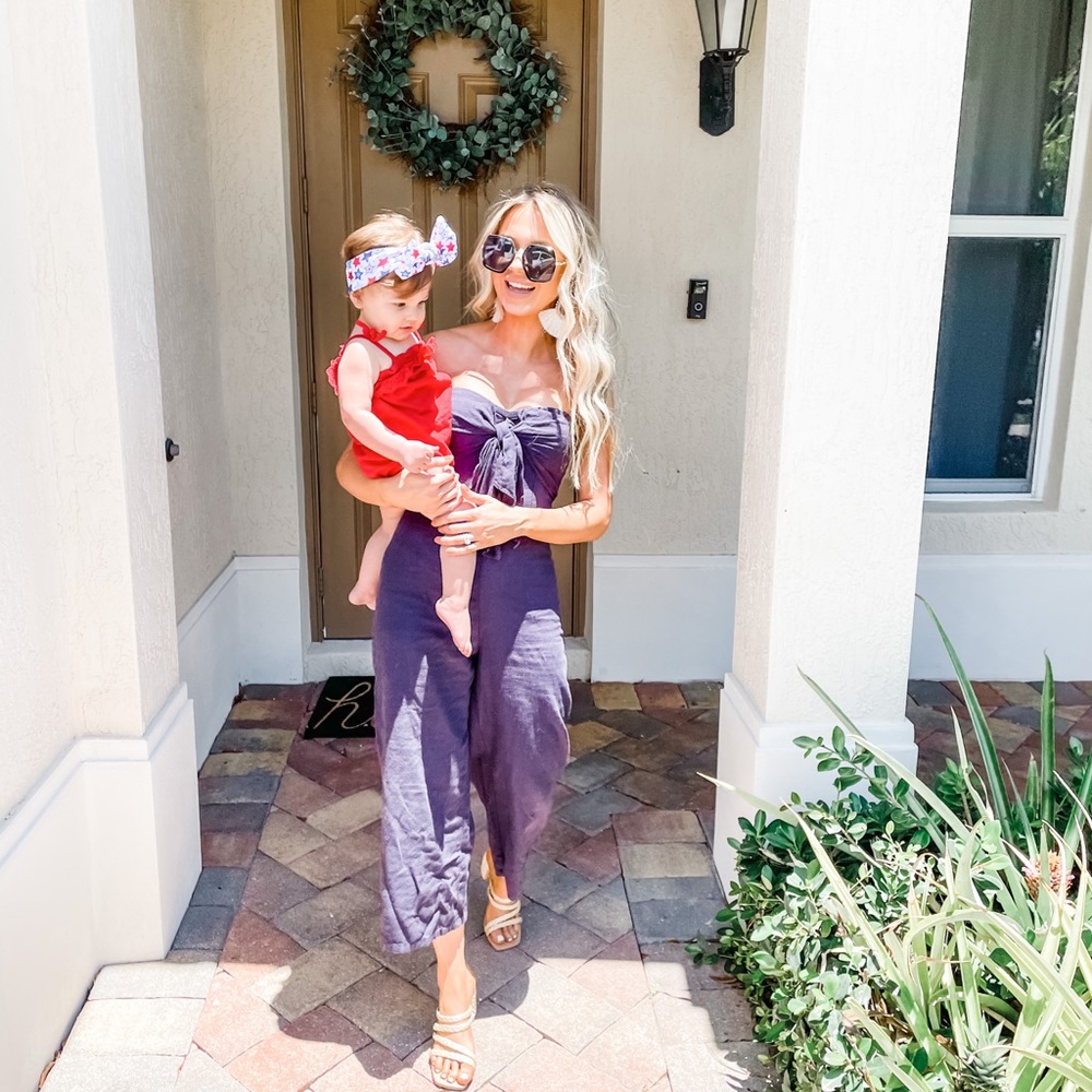 NAVY STRAPLESS JUMPSUIT WITH BOW